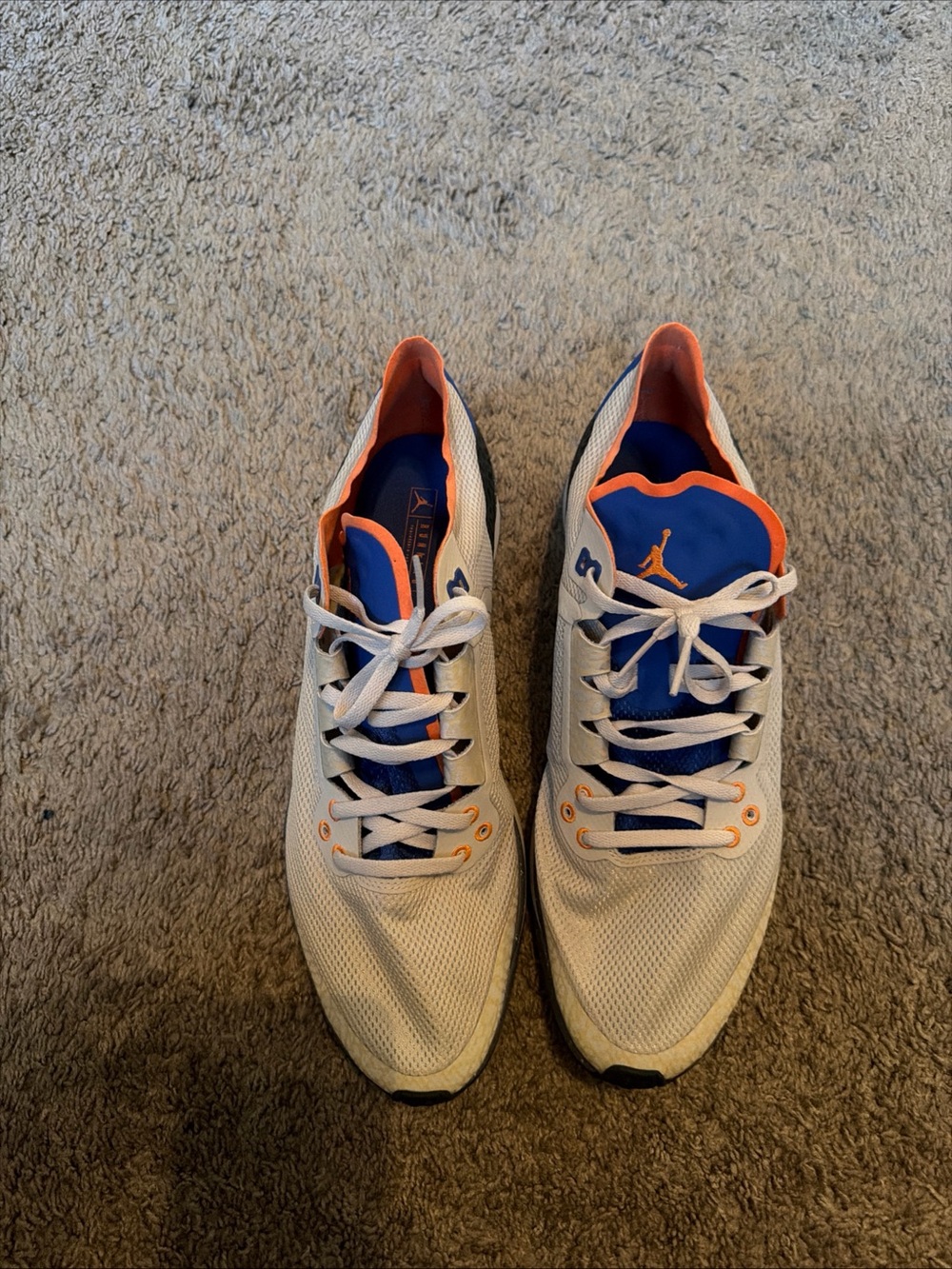 Nike White Sneakers with Blue and Orange Accents
